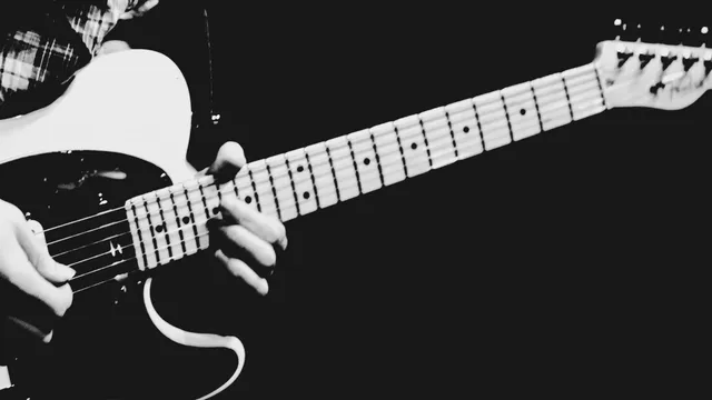 Alexander James Wallace playing a Telecaster guitar